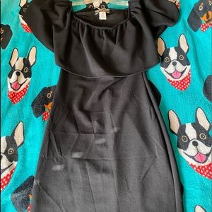 A cute tight fitted black midi dress